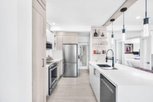 Modern kitchen after photo by done Luxe Home Renovation